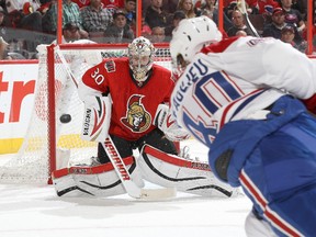 Andrew Hammond #30 of the Ottawa Senators makes a blocker save on a shot by Nathan Beaulieu #40 of the Montreal Canadiens during an NHL pre-season game at Canadian Tire Centre on September 25, 2013 in Ottawa, Ontario, Canada.  Jana Chytilova/Freestyle Photography/Getty Images/AFP
