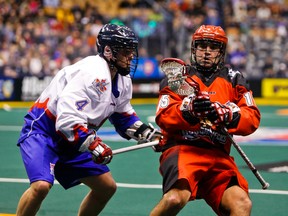 Rock attacker Jesse Gamble (left) closes in on Calgary Roughnecks’ Shawn Evans during their game at the Air Canada Centre in early January. The teams meet again on Saturday in Calgary. (Ernest Doroszuk/Toronto Sun)