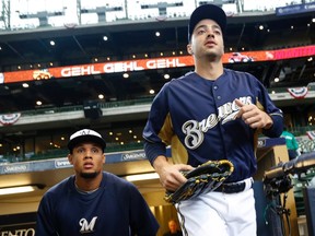 Milwaukee Brewers' Ryan Braun runs onto the field for warm ups before opening day of baseball season as the Brewers take on the Colorado Rockies in a MLB National League baseball game in Milwaukee, Wisconsin in this April 1, 2013, file photo. (REUTERS/Darren Hauck/Files)