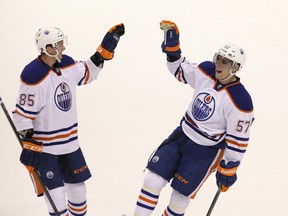 Stu MacGregor points to second-round pick Martin Marincin, left, shown celebrating a goal with David Perron, as an example of a successful late rounder, and says a number of other prospects in the system from later rounds are shaping up nicely. (Carmine Marinelli, QMI Agency)