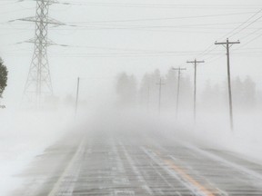 Heavy drifting and whiteout conditions were the norm once you got outside the city boundaries, on Westminster Drive in London, Ont. on Thursday February 27, 2014 the strong winds were pushing cars across the road. 
Strong northwest winds caused whiteout conditions that caused a rash of accidents in the morning.
Mike Hensen/The London Free Press/QMI Agency