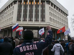 A man gestures during a pro-Russian rally outside the Crimean parliament building in Simferopol February 27, 2014.  REUTERS/Baz Ratner