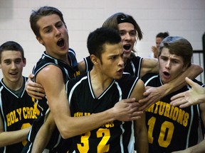 Holy Cross guard Chad Gopaul is surrounded by his teammates seconds after hitting a game winning shot to bring Holy Cross its first ever TVRA ‘A’ senior boys basketball Championship. The Cens topped North Middlesex by a count of 49-46 in London.
Photo courtesy Amber O'Callaghan