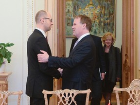 Arseny Yatsenyuk (L), a member of Ukraine's interim leadership, greets Canada's Foreign Minister John Baird during their meeting in Kiev February 28, 2014. REUTERS/Andrew Kravchenko/Pool