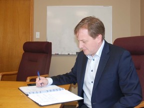 Jeff Yurek, MPP for Elgin-Middlesex-London, looks over his notes after meeting with constituents to discuss their concerns over the next Ontario budget.