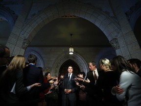 Liberal leader Justin Trudeau speaks to journalists on Parliament Hill in Ottawa February 25, 2014. REUTERS/Chris Wattie