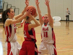 St. Lawrence Vikings Lacey Knox, left, and Haley Gourdier guard a Fanshawe Falcons player during a second-round game at the OCAA women's basketball championship tournament in Hamilton on Friday. The Vikings won 59-51 to remain in contention for a bronze medal. (SLC Athletics)