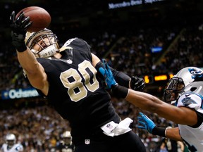 Jimmy Graham (80) of the New Orleans Saints has a pass broken up by Mike Mitchell of the Carolina Panthers at Mercedes-Benz Superdome December 8, 2013 in New Orleans. (Chris Graythen/Getty Images/AFP)