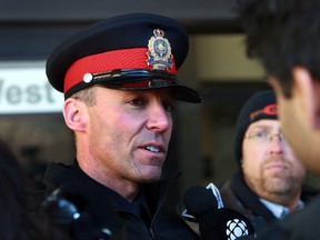 The Edmonton Police Service's Troy Carriere speaks to the media outside the courthouse in Edmonton, Alberta on Friday, Feb 27, 2014.  Paul Vukmanich, the killer of Edmonton police service dog Quanto, was sentenced on Friday to 26 months in prison.  Perry Mah/ Edmonton Sun/