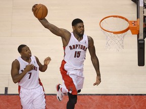 Raptors forward Amir Johnson throws down a dunk against the Wizards on Thursday. Johnson tweaked his ankle in the game. (USA Today/photo)