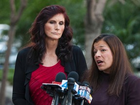 Cindy Lee Garcia (L), an actress in the "Innocence of Muslims", an anti-Islam movie that has spawned violent protests across the Muslim world, and her lawyer M. Cris Armenta hold a news conference after a court hearing in Los Angeles, California September 20, 2012. (REUTERS/Bret Hartman)