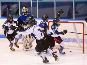 Series MVP Tanner Ferreira of CCH (7) and teammates celebrate his winning goal against Oakridge in the third period of Game 3 of the TVRA Central Conference championship at Thompson arena on Friday. The Crusaders won the game 3-1 and the series 2-1. (MIKE HENSEN, The London Free Press)