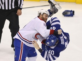 Canadiens’ Brandon Prust flips Maple Leafs’ Troy Bodie during a scrap last month in Toronto. (JACK BOLAND/TORONTO SUN)