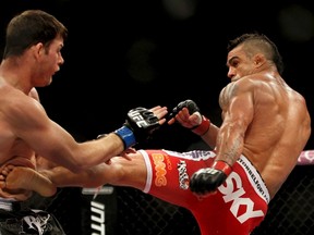 Vitor Belfort (right) kicks Michael Bisping during the UFC event in Sao Paulo, Brazil January 20, 2013. (REUTERS/Paulo Whitaker)