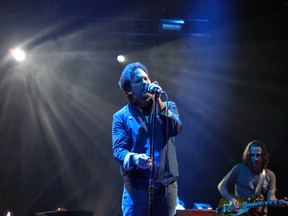 Eddie Vedder, lead singer of Pearl Jam, performs at the Scotiabank Saddledome in Calgary, Alta. on Monday December 2, 2013. (Mike Drew/QMI Agency)