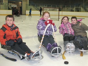 The Children's Treatment Centre of Chatham-Kent offers a sledge hockey and adapted skating program at Thames Campus Arena. Among the participants, are, from left: Ethan Walker, 9, Ella Timmermans, 8, Hayley Allman, 8, and Michael Allman, 11.