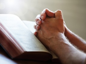 Praying.

(Fotolia)