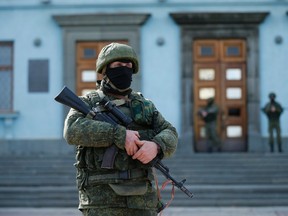 Canadians were encouraged to leave Crimea or stay indoors because of escalating military activity, political unrest and ongoing demonstrations and clashes.

REUTERS/David Mdzinarishvili