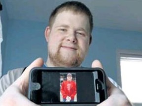 Chris Woitowich shows off the video he made, when challeged by a friend with a nekomination. Woitowich decided to do something generous: He gave a homeless person food, made a video of it then posted it on his Facebook page. 
GINO DONATO/THE SUDBURY STAR