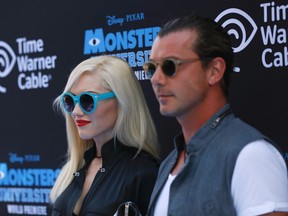 Musician Gwen Stefani (L) and her husband singer Gavin Rossdale pose at the premiere of the film "Monsters University" at El Capitan theatre in Hollywood, California June 17, 2013. REUTERS/Mario Anzuoni