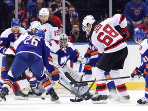 New Jersey Devils forward Jaromir Jagr (68) scores on New York Islanders goalie Evgeni Nabokov (20) during the second period at Nassau Veterans Memorial Coliseum Saturday. The goal was the 700th of Jagr's career. (Brad Penner/USA TODAY Sports)
