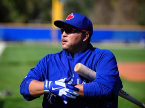 Blue Jays catcher Dioner Navarro wears the No. 30 in honour of his wife, Sherley, who survived a life-threatening brain aneurysm on Sept. 30, 2003. Navarro agreed to a two-year deal with the Jays in the off-season. (david manning/ USA Today Sports)