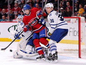 Leafs defenceman Carl Gunnarsson keeps an eye on Daniel Briere of the Canadiens in Montreal on Saturday night. Briere was called for goaltender interference on the play. (Richard Wolowicz/Getty Images/AFP)