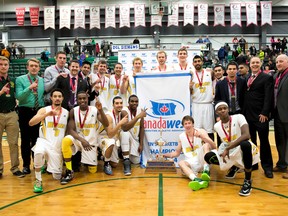 Alberta Golden Bears basketball team with the Canada West banner and trophy at the Saville Community Sports Centre on March 1, 2014.
credit: Golden Bears and Pandas Athletics