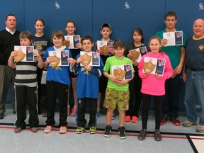 The Knights of Columbus held their annual free-throw competition at Christ the King on Jan. 16. Winners included: (in no particular order) Ty Myers, Spencer Chatel, Brett Wadsworth, Morgan Gorry, Katelyn Parkes, Tallie Laprise, Kamryn Hull, Mitchell O'Bradovic, April Jacobs and Jonathan Cartier. Presenting the awards are Ed Freeburn, left, and Barry McFadden. The winners advanced to the district competition in Corunna. From there, Ty Myers and Mitchell O'Bradovic made it to the regional competition in London on March 1.