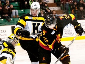 Belleville's Jake Bricknell tries to poke a rebound past Kingston goalie Matt Mahalak during OHL game Saturday night at Yardmen Arena. (DON CARR for The Intelligencer)