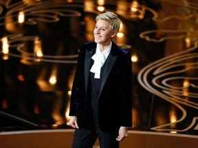 Ellen Degeneres takes the stage to host the show at the start of the 86th Academy Awards in Hollywood, California March 2, 2014.    REUTERS/Lucy Nicholson