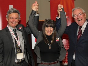 Sophie Kiwala, with her partner Chris Van DerVyer, left, and current MPP John Gerretsen, after she was voted as the next provincial Liberal candidate for Kingston and the Islands at the candidate nomination meeting held at the Four Points Sheraton on Sunday. (Julia McKay/The Whig-Standard)