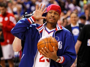 Former Philadelphia 76er great Allen Iverson acknowledges cheers from the fans as he brings out the game ball ahead of the 76ers game against the Boston Celtics in Game 6 of their NBA Eastern Conference semi-final playoff basketball series in Philadelphia May 23, 2012. (TIM SHAFFER/Reuters)