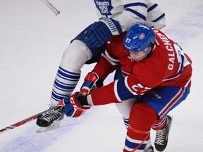Leafs forward Joffrey Lupul, colliding with Alex Galchenyuk of Montreal on Saturday, doesn’t expect his team to be busy as the National Hockey League trade deadline approaches. (MARTIN CHEVALIER/QMI Agency)