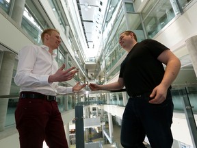 U of A students Aaron Upright (left) and Chris Robson chat about their crowdfunding idea involving a satelite project at the university on Sunday. Perry Mah/Edmonton Sun