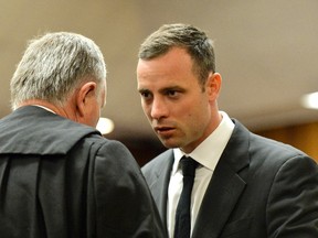 Oscar Pistorius arrives in court ahead of his trial at the North Gauteng High Court in Pretoria on March 3, 2014. (REUTERS/Herman Verwey/Pool)