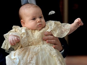Britain's Prince William carries his son Prince George as they arrive for his son's christening at St. James's Palace in London on October 23, 2013. (REUTERS/John Stillwell/Pool)