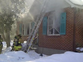 Ottawa firefighters battle a house fire on Tweedsmuir Ave. in the west end on Monday, March 3, 2014. No one was injured. (OTTAWA FIRE DEPARTMENT submitted image)