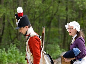 Alex Cuberovic and Kassandra Kearse walk through the British encampment during the annual Battle Of Longwoods weekend in May put on by the Upper Thames Military Reenactment Society at the Longwoods Conservation Area near Delaware. (DEREK RUTTAN/ QMI AGENCY)