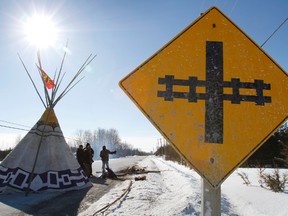 A teepee sits in the middle of Shannonville Road, south Hinchey Road and Airport Parkway, in Tyendinaga Township after protesters erected two barricades in the area Monday, March 3, 2014. Protesters are demanding an inquiry into the hundreds of missing Native women across the country. - JEROME LESSARD/The Intelligencer/QMI Agency