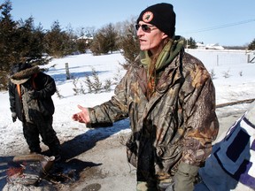 Mohawk activist Shawn Brant speaks with media near a teepee in the middle of Shannonville Road, south Hinchey Road and Airport Parkway, in Tyendinaga Township after he and less than a dozen protesters erected two barricades in the area Monday, March 3, 2014. - FILE PHOTO BY: JEROME LESSARD/The Intelligencer/QMI Agency