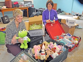 Members of the Upper Thames Missionary Church in Mitchell left for a one-week missions trip to Guatemala on Saturday, March 1. Seen here packing a few last minute items on Thursday were sisters, Tara Van Pelt (left) and Shelley Scott. KRISTINE JEAN/MITCHELL ADVOCATE