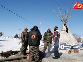 A teepee sits in the middle of Shannonville Road on Tyendinaga Mohawk Territory after protesters erected two barricades Monday. Protesters are demanding an inquiry into the hundreds of missing Native women across the country. 
JEROME LESSARD/The Intelligencer/QMI Agency