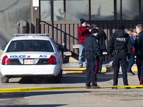 Edmonton Police Service officers investigate after two people were killed and four others injured in a multi-stabbing at a Loblaws Companies Limited warehouse at 16104 121A Avenue in Edmonton, Alta., on Friday, Feb. 28, 2014. Police are looking for the public's help in locating Jayme Pasieka, 29, who is said to be driving a 1999 two-door green Ford Explorer with the licence plate KEL 155. Ian Kucerak/Edmonton Sun