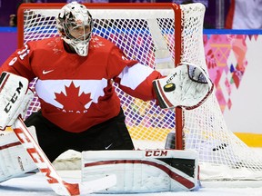 Canada's goalie Carey Price makes a save against Sweden during the men's hockey gold-medal game at the Sochi 2014 Winter Olympics, Feb. 23, 2014. (BEN PELOSSE/QMI Agency)
