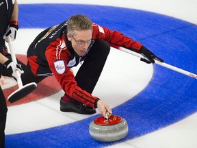 Ontario skip Greg Balsdon throws a rock in the fifth end against New Brunswick during the Brier in Kamloops, B.C., on Monday, March 3, 2014. (Ben Nelms/Reuters)