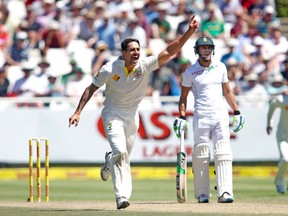 Australia’s Mitchell Johnson celebrates taking the wicket of South Africa’s AB de Villiers during Monday’s match.