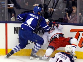 Maple Leafs defenceman Cody Franson hits Brandon Dubinsky of the Columbus Blue Jackets during the third period last night at the Air Canada Centre. The Blue Jackets won 2-1. (MICHAEL PEAKE/Toronto Sun)