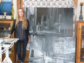 Young artist Rhiana Sneyd readies works in her London studio for her first solo show.  She uses black and white to convey light and shadow of urban settings.
