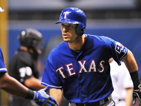 Former Texas Rangers infielder Ian Kinsler #5 of the Texas Rangers celebrates after a home run on the first pitch of the game against the Tampa Bay Rays September 17, 2013 at Tropicana Field in St. Petersburg, Florida. (Al Messerschmidt/Getty Images/AFP)